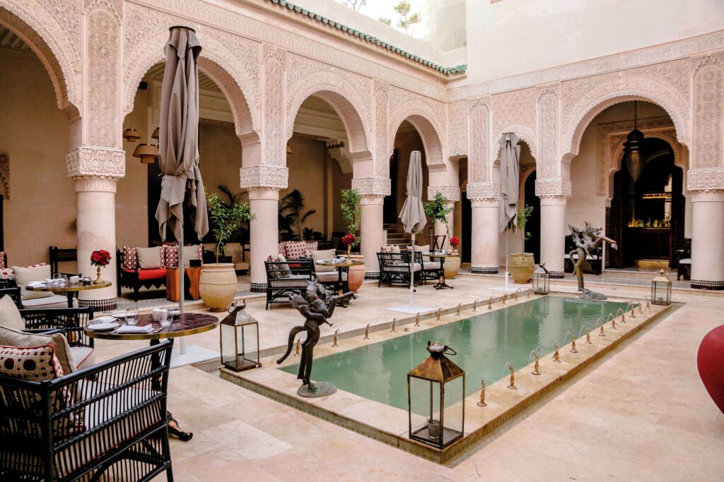 An interior patio and pool at Riad Fes - one of the best luxury hotels in Fes for solo travellers