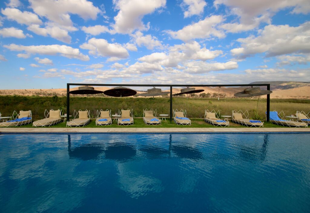 A swimming pool at a luxury desert camp in Agafay, Morocco