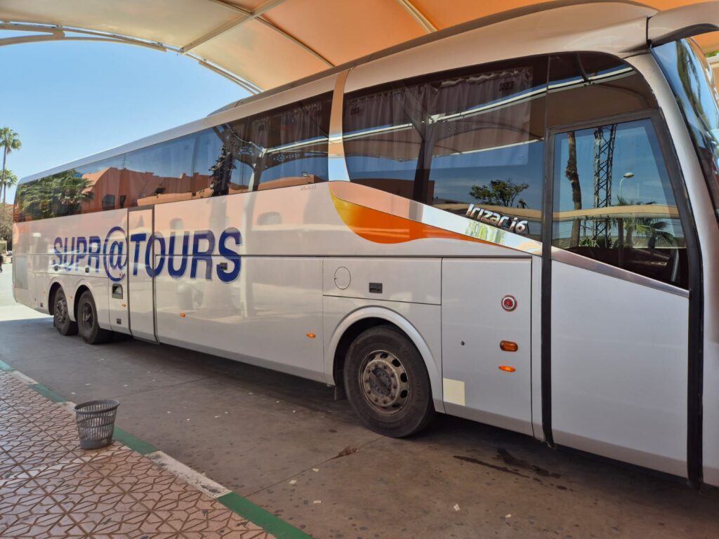 A Supratours bus parked at a station in Morocco. Travelling bus bus is one of the easiest ways to get around Morocco as a solo traveller