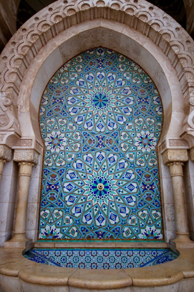Morocco shopping tips: Zellige tiles decorate an ornate arch at the Hassan II Mosque in Casablanca