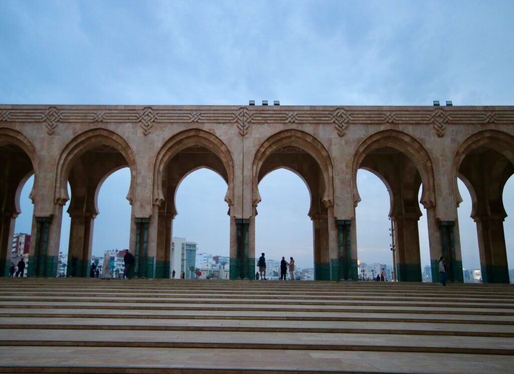 Solo traveller's guide to Casablanca: Arches frame the city skyline at the Hassan II Mosque