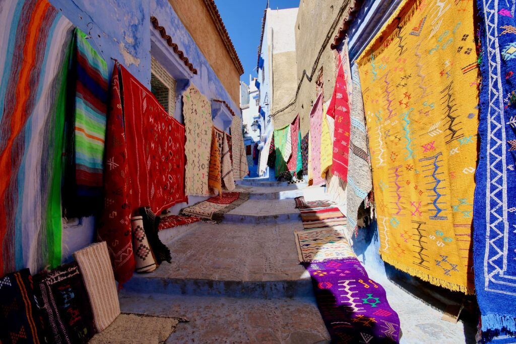 What to buy in Morocco: Amazigh rugs for sale in the blue-washed streets of the Chefchaouen medina