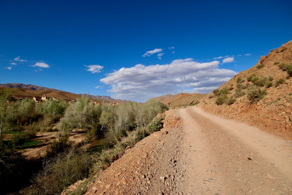A hiking trail leads along the edge of Dades Gorge, partway between Marrakech and Merzouga