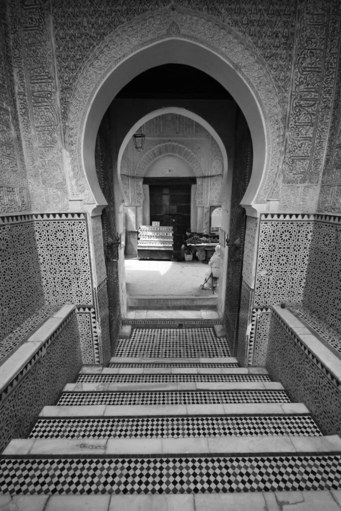 An arched entrance leads to the Bou Inania Madrasa