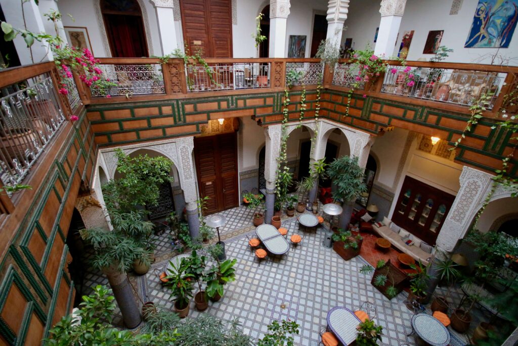 Plants decorate the interior courtyard of a beautiful Fes riad