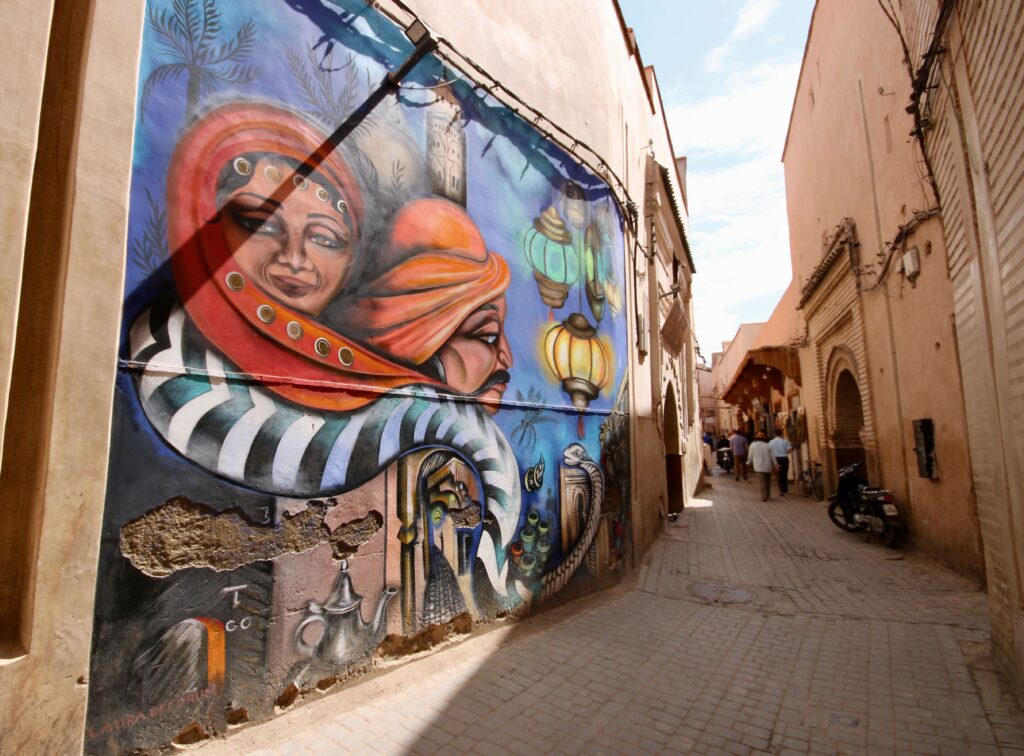 A colourful mural in a narrow street of the Marrakech medina - a popular destination for group tours and independent travellers in Morocco