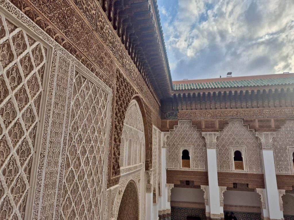 Intricate details on the courtyard walls of Ben Youssef Madrasa in Marrakech