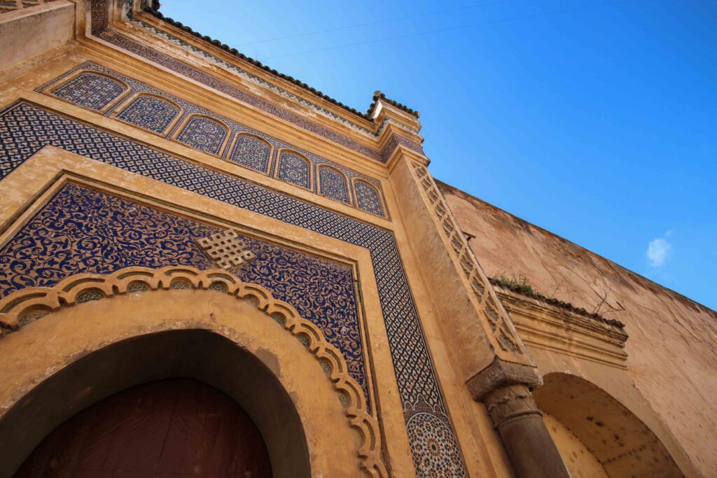 Admiring the magnificent gate of Bab El Mansour on a small-group tour from Fes to Meknes