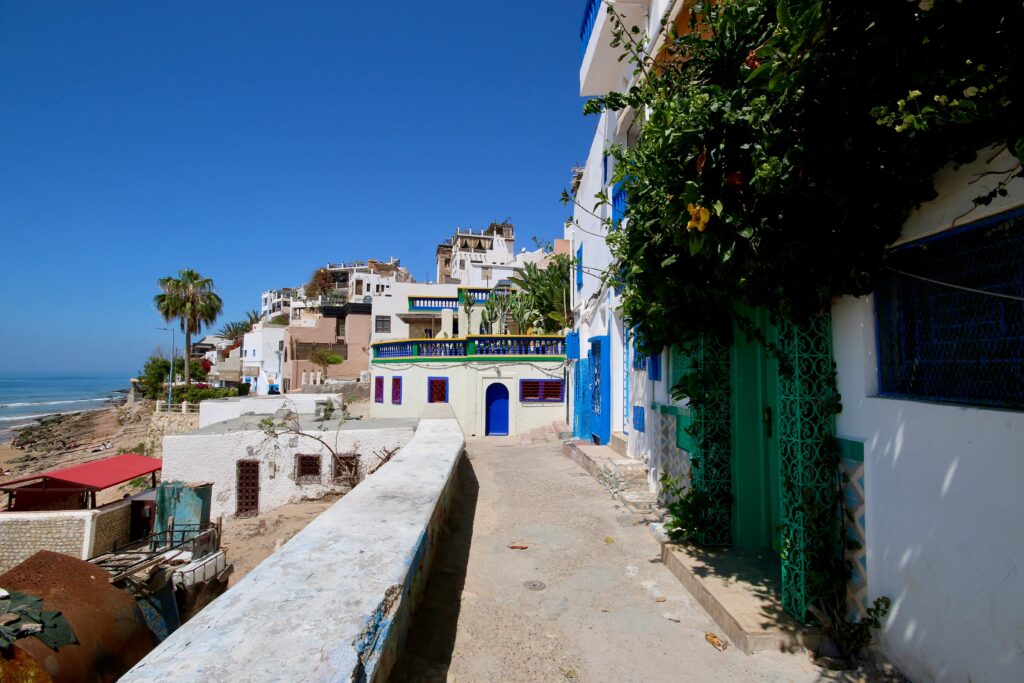 Colourful houses line the waterfront of Taghazout, Morocco