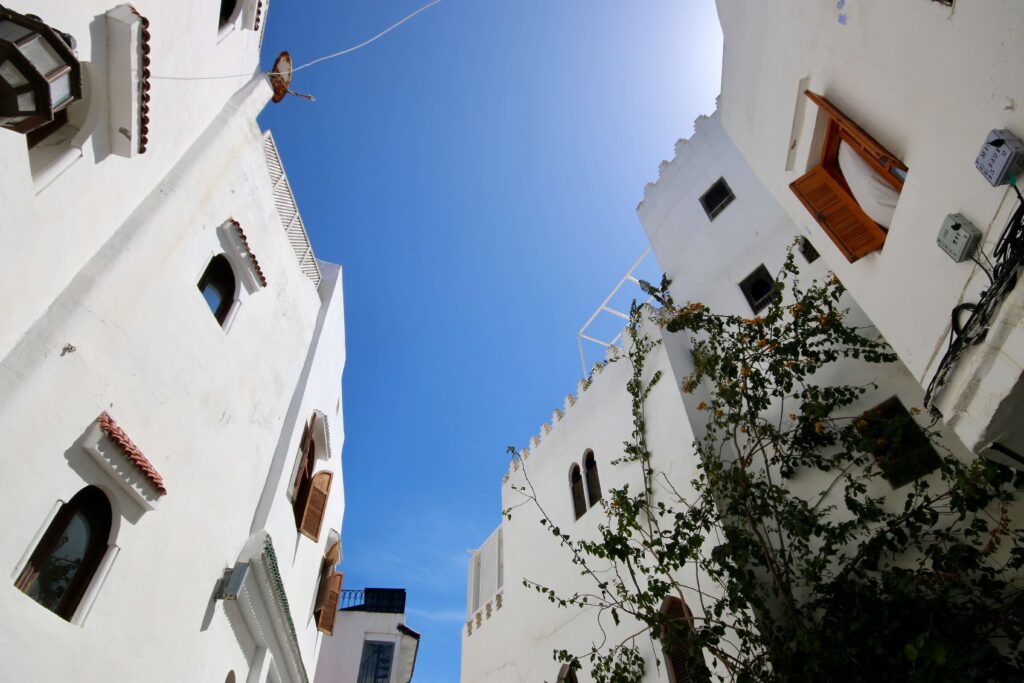 Whitewashed buildings against a bright blue sky in Tangier's Kasbah district