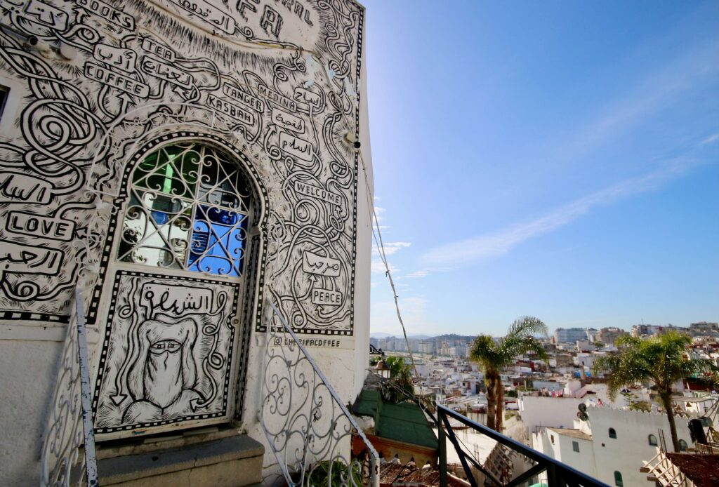 Morocco packing guide: An art-adorned building overlooking the whitewashed streets of Tangier