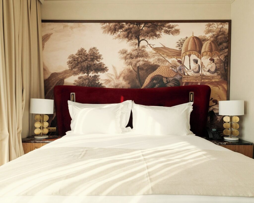 A mural behind a bed at a luxury hotel in Casablanca