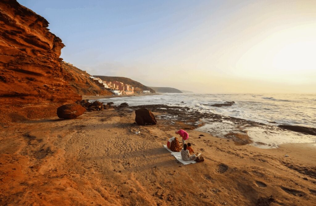 Off-the-beaten-path Morocco destinations: Sunset illuminates the cliffs of Mirleft