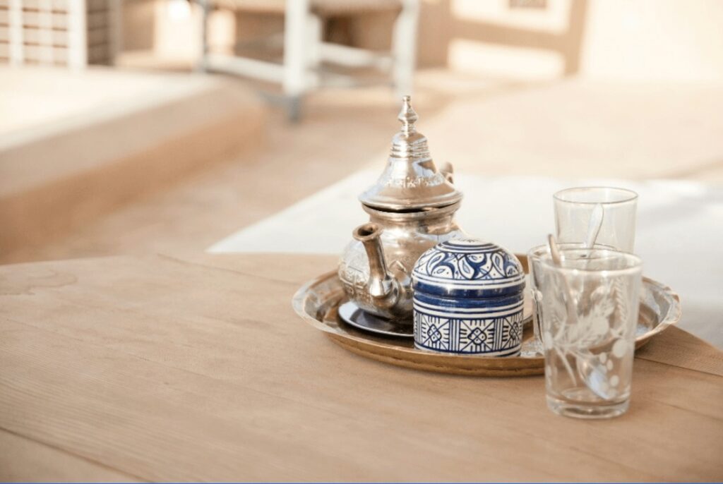A decorative Moroccan teapot with glasses