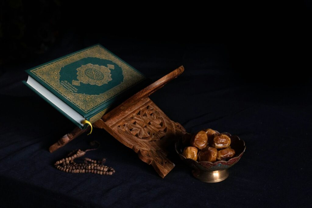 Travelling to Morocco during Ramadan: A Quran with a bowl of dates